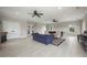 Spacious clubhouse with modern tile flooring, a blue couch, and double doors at 3735 Hazel Ave, Cumming, GA 30040