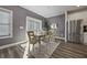 Cozy dining area with modern table, stylish chairs, and sliding door to backyard at 3735 Hazel Ave, Cumming, GA 30040