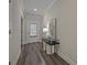 Bright entryway with hardwood floors, stylish console table, and elegant decor at 3735 Hazel Ave, Cumming, GA 30040