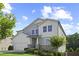 Well-maintained two-story home with attached garage, manicured lawn and mature trees at 3735 Hazel Ave, Cumming, GA 30040