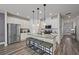 Modern kitchen with stainless steel appliances, granite countertops, and an island with seating at 3735 Hazel Ave, Cumming, GA 30040