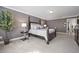 Comfortable bedroom showcasing stylish furniture, a tree, and neutral decor for a relaxing retreat at 3735 Hazel Ave, Cumming, GA 30040