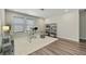Bright and airy office space with a glass desk, modern shelving, and a neutral color palette at 3735 Hazel Ave, Cumming, GA 30040
