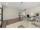 Bright home office with a glass desk, comfortable seating, and modern decor at 3735 Hazel Ave, Cumming, GA 30040