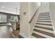 Staircase to the second floor featuring hardwood treads, white risers, and a modern railing at 3735 Hazel Ave, Cumming, GA 30040