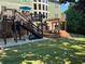 Large, grassy backyard with a wooden deck, pergola, and a hot tub perfect for entertaining at 3820 Preserve Crossing Ln, Cumming, GA 30040