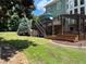 Beautiful backyard with a deck, pergola, hot tub, and lush greenery, creating a serene outdoor space at 3820 Preserve Crossing Ln, Cumming, GA 30040