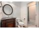 Bathroom features a round mirror, a starburst pattern and a tub with shower at 3820 Preserve Crossing Ln, Cumming, GA 30040