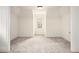 A bright and airy empty room featuring neutral paint and plush carpeting at 3820 Preserve Crossing Ln, Cumming, GA 30040