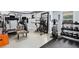 Well-equipped home gym featuring a treadmill, exercise bike, weights, and a large mirror at 3820 Preserve Crossing Ln, Cumming, GA 30040