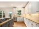 A gourmet kitchen featuring granite countertops, stainless steel appliances, and custom cabinetry at 3820 Preserve Crossing Ln, Cumming, GA 30040