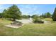 Picturesque pond with a fountain and a picnic table, perfect for outdoor relaxation at 3820 Preserve Crossing Ln, Cumming, GA 30040