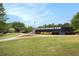 Well-maintained tennis court surrounded by lush greenery in a community setting at 3820 Preserve Crossing Ln, Cumming, GA 30040
