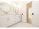 Bright bathroom showcasing double vanities, gold fixtures, and an open doorway at 550 Fisher Dr # 47, Alpharetta, GA 30009
