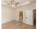 Spacious bedroom with tray ceiling, accent wall and an ensuite bathroom at 550 Fisher Dr # 47, Alpharetta, GA 30009