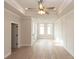Bedroom with tray ceiling, recessed lights, and a large paneled wall feature at 550 Fisher Dr # 47, Alpharetta, GA 30009