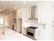 Well-appointed kitchen featuring a spacious island, stainless steel appliances, and ample cabinet space at 550 Fisher Dr # 47, Alpharetta, GA 30009