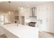 Open concept kitchen with a large center island, and stainless steel appliances at 550 Fisher Dr # 47, Alpharetta, GA 30009