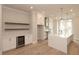 Contemporary kitchen with a large island, custom cabinetry, built-in wine cooler, and pendant lighting fixtures at 550 Fisher Dr # 47, Alpharetta, GA 30009