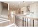 Open-concept kitchen featuring a large island and hardwood floors at 550 Fisher Dr # 47, Alpharetta, GA 30009