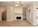 Inviting living room with a fireplace, shiplap accent wall, and hardwood floors for a cozy atmosphere at 550 Fisher Dr # 47, Alpharetta, GA 30009