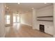 Open-concept living room featuring hardwood floors, recessed lighting, and a built-in bar area at 550 Fisher Dr # 47, Alpharetta, GA 30009