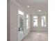 Bright living room with hardwood floors, large windows, and neutral paint at 550 Fisher Dr # 47, Alpharetta, GA 30009