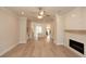 Spacious living room with an open floor plan, hardwood floors, and a fireplace for comfortable living at 550 Fisher Dr # 47, Alpharetta, GA 30009