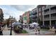 Bustling market street scene with pedestrian traffic, vendor tents, and charming architecture at 550 Fisher Dr # 47, Alpharetta, GA 30009