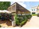 Stylish outdoor restaurant featuring covered seating, lush greenery, and an inviting ambiance at 550 Fisher Dr # 47, Alpharetta, GA 30009