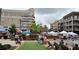 Vibrant town square featuring a splash fountain, market vendors, and outdoor seating for community gatherings at 550 Fisher Dr # 47, Alpharetta, GA 30009
