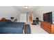 Cozy bedroom featuring a bed, desk and carpet flooring at 1570 Woodberry Run Dr, Snellville, GA 30078