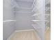 Walk-in closet featuring wire rack shelving and neutral carpeting at 1570 Woodberry Run Dr, Snellville, GA 30078