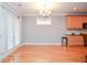 Bright dining area with hardwood floors next to kitchen and access to outside at 1570 Woodberry Run Dr, Snellville, GA 30078
