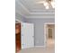 Empty room with white trim, neutral walls, and doorway entry at 1570 Woodberry Run Dr, Snellville, GA 30078