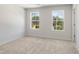 Spacious bedroom with plush carpet and large windows overlooking a scenic pond at 2853 Bullfrog Ln # 172, Gainesville, GA 30115