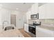 Kitchen featuring granite countertops, stainless steel appliances, and ample counter space at 2853 Bullfrog Ln # 172, Gainesville, GA 30115