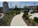 Community area showcasing sidewalks, a stone outdoor fireplace and a well-manicured lawn at 3010 Florence St, Cumming, GA 30041