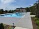 Large community pool with an expansive sun deck, lounge chairs, and mature landscaping at 3010 Florence St, Cumming, GA 30041