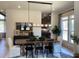 Open dining room with contemporary light fixture, lots of natural light, and modern decor at 3010 Florence St, Cumming, GA 30041
