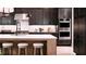 Contemporary kitchen featuring a large island with seating and stainless steel appliances at 3010 Florence St, Cumming, GA 30041