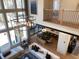 Open concept living room with soaring ceilings, modern light fixture, and contemporary furnishings at 3010 Florence St, Cumming, GA 30041