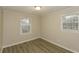 A bright bedroom featuring neutral paint, new flooring and windows, offering a calm and inviting atmosphere at 4631 Ben Hill Rd, Douglasville, GA 30134