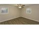 Cozy bedroom with laminate flooring, a ceiling fan, and natural light at 4631 Ben Hill Rd, Douglasville, GA 30134