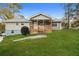 Charming single-Gathering home with inviting front porch, lush lawn, and mature trees at 4631 Ben Hill Rd, Douglasville, GA 30134