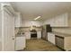 Kitchen featuring stainless steel appliances, granite countertops, and white cabinetry at 4631 Ben Hill Rd, Douglasville, GA 30134
