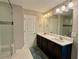 Bathroom featuring double vanity with white countertops, and large mirror at 2145 Coventry Dr, Brookhaven, GA 30319