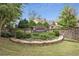 Beautiful community entrance sign amidst mature landscaping and a stone wall at 2145 Coventry Dr, Brookhaven, GA 30319