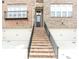 Beautiful townhome exterior with brick stairs leading to the front door and one car garage at 2145 Coventry Dr, Brookhaven, GA 30319