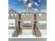 Charming townhome exterior featuring brick facade, balcony, and attached one car garages at 2145 Coventry Dr, Brookhaven, GA 30319